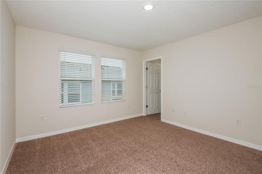 Spacious, unfurnished interior of a new home in Grove at Crosswind, Haines City (Image 20).