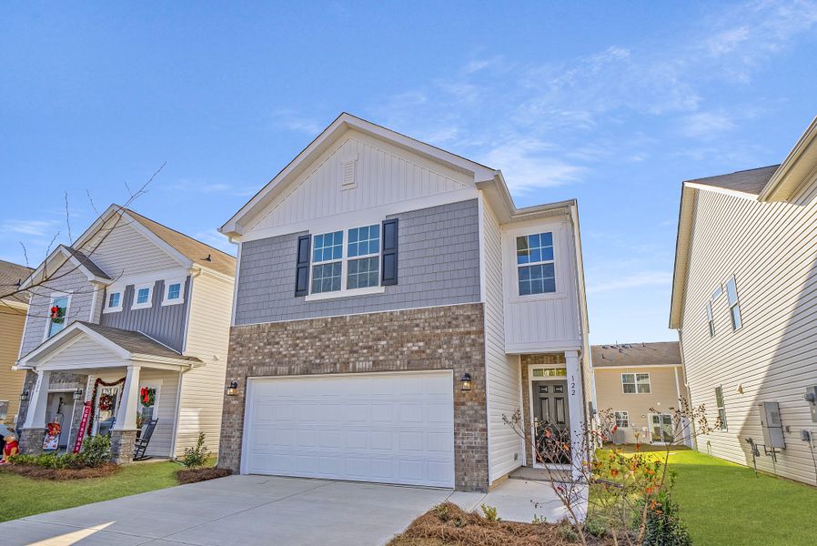 Front exterior of a new home in Taylor Hill: Midlands, Gilbert, SC, highlighting curb appeal (Image 1). Front exterior of a new home in Taylor Hill: Midlands, Gilbert, SC, highlighting curb appeal (Image 1).