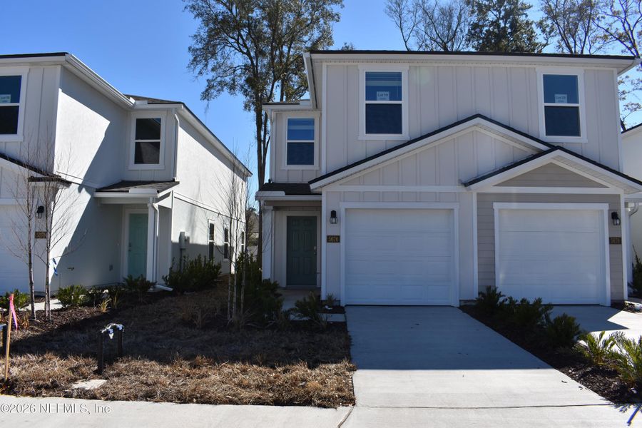 Front exterior of a new home in Irongate Villas, Jacksonville, FL, highlighting curb appeal (Image 2).