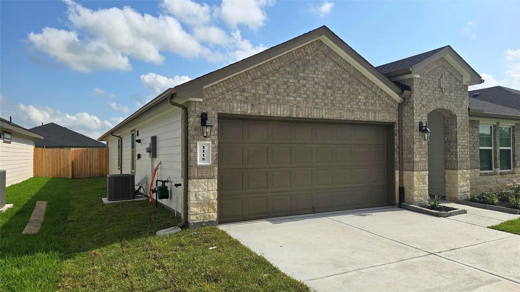 Front exterior of a new home in Caldwell Ranch, Rosharon, TX, highlighting curb appeal (Image 16).