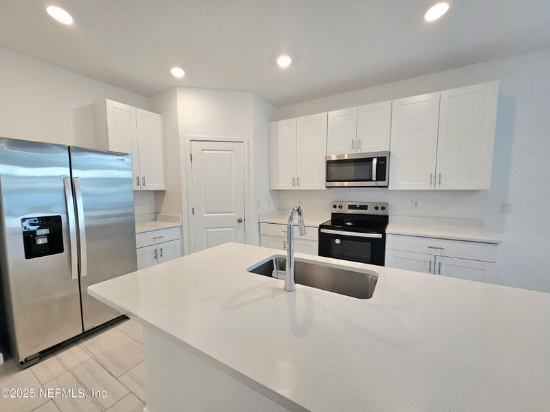 Furnished interior view inside a new home in Lakes at Bella Lago - Signature Series, Green Cove Springs (Image 7).