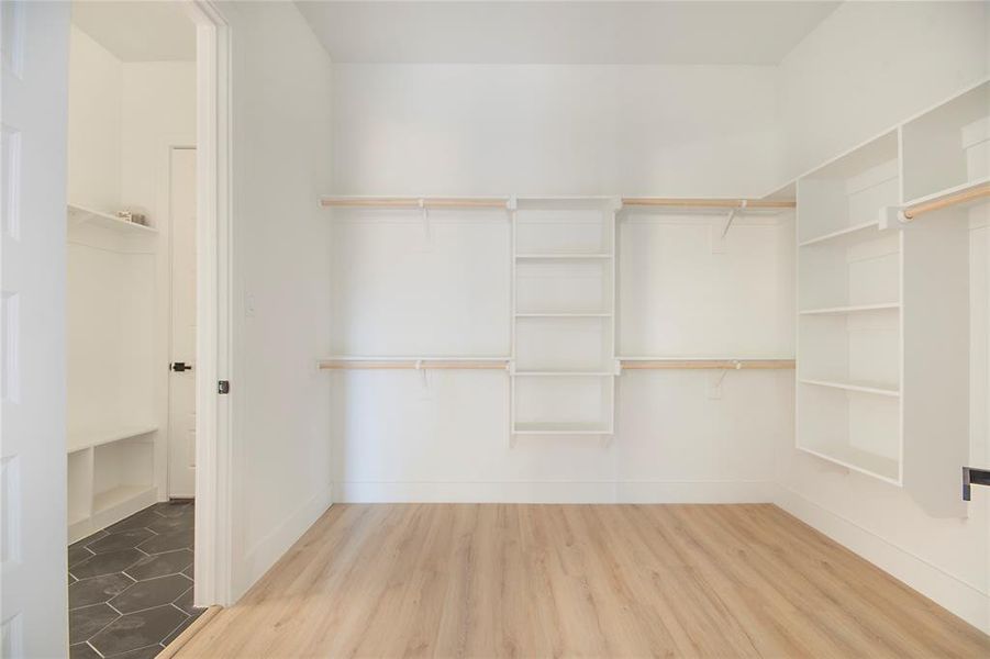 Spacious closet with wood finished floors Spacious closet with wood finished floors
