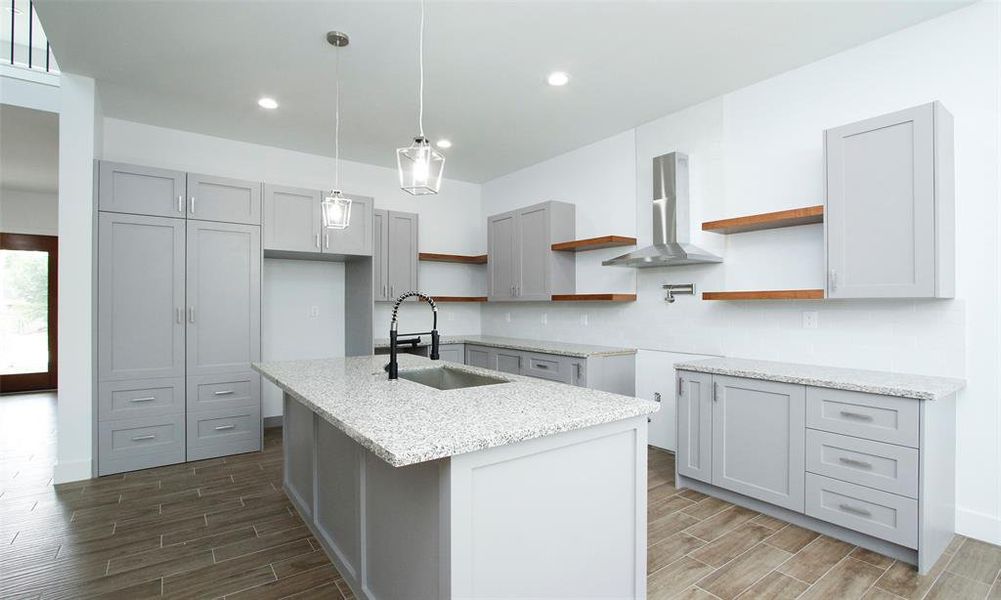 Seamless pantry and laundry access via integrated cabinet doors for a clutter-free look.