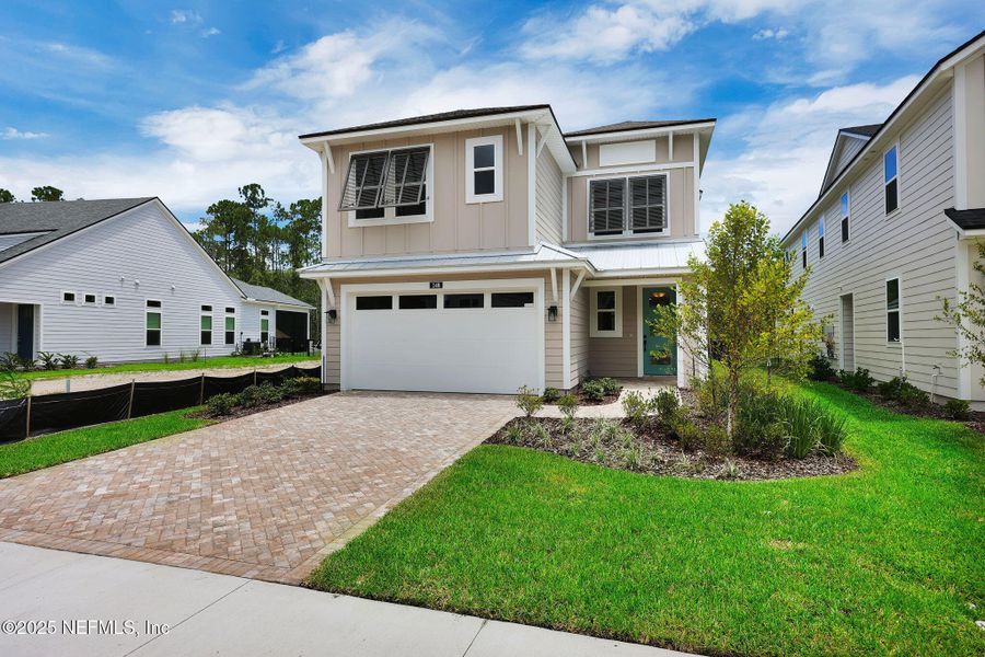 Front exterior of a new home in Reflections at Nocatee, Ponte Vedra, FL, highlighting curb appeal (Image 2).