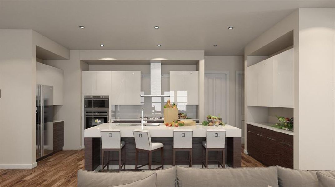 Kitchen featuring white cabinets, modern cabinets, appliances with stainless steel finishes, and wall chimney range hood