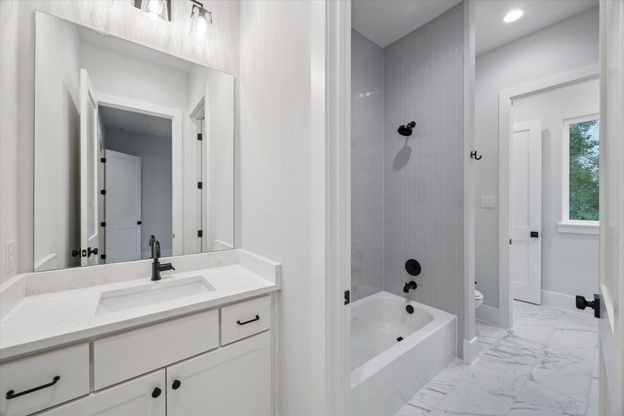 Hollywood Bath connecting the 2nd and 3rd Bedrooms.