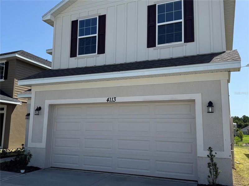 Front exterior of a new home in Harmony Central, Harmony, FL, highlighting curb appeal (Image 23). Front exterior of a new home in Harmony Central, Harmony, FL, highlighting curb appeal (Image 23).