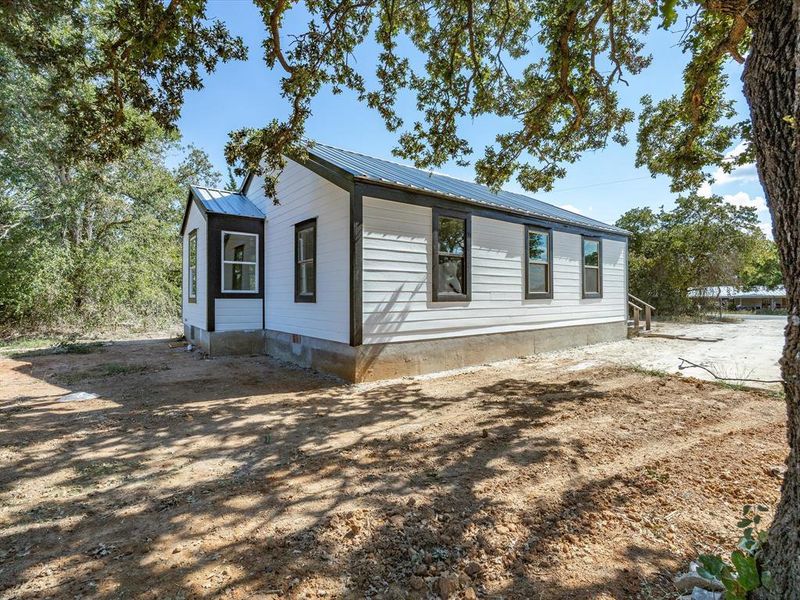 Exterior details and patio area of a home in , Springtown (Image 3).