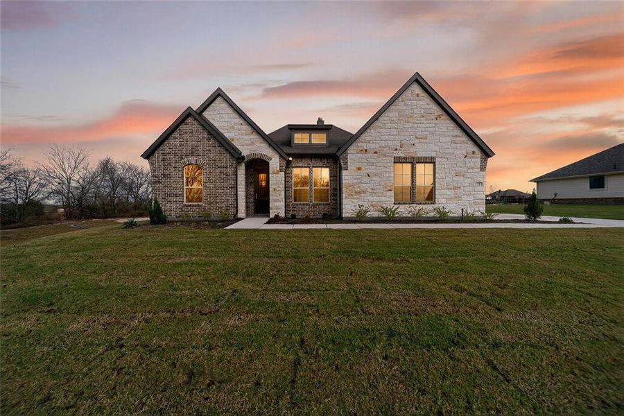 Front exterior of a new home in Nash Estates, Tom Bean, TX, highlighting curb appeal (Image 25).