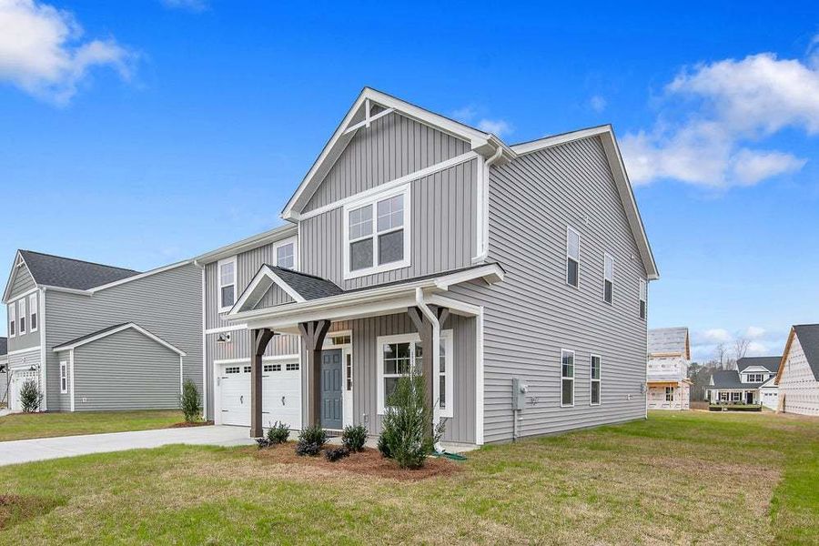Representative exterior photo of a completed home built from the Magnolia by Caviness & Cates Communities in Bartlett Manor, Youngsville, NC (Image 9).