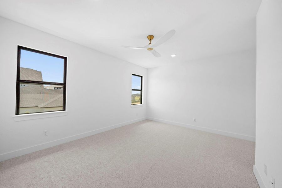 Spacious bedroom offering a comfortable layout, natural light, and contemporary finishes.