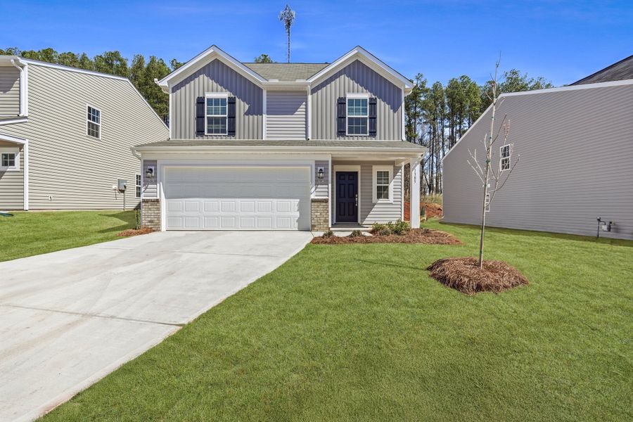 Front exterior of a new home in Cleveland Meadows, Spartanburg, SC, highlighting curb appeal (Image 1). Front exterior of a new home in Cleveland Meadows, Spartanburg, SC, highlighting curb appeal (Image 1).