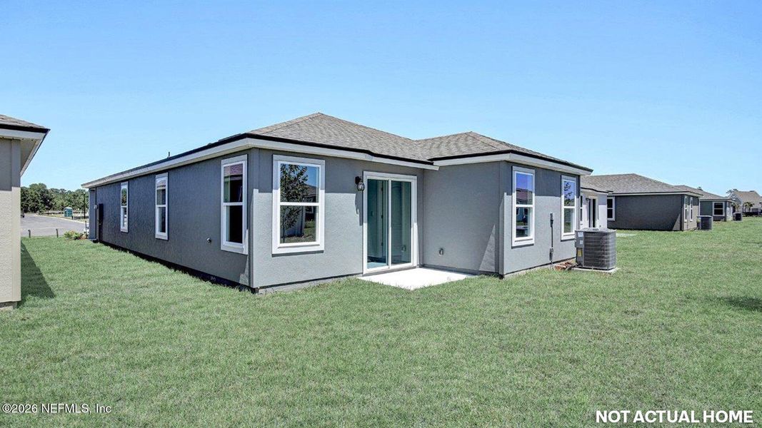 Exterior details and patio area of a home in Grand Reserve, Bunnell (Image 2).