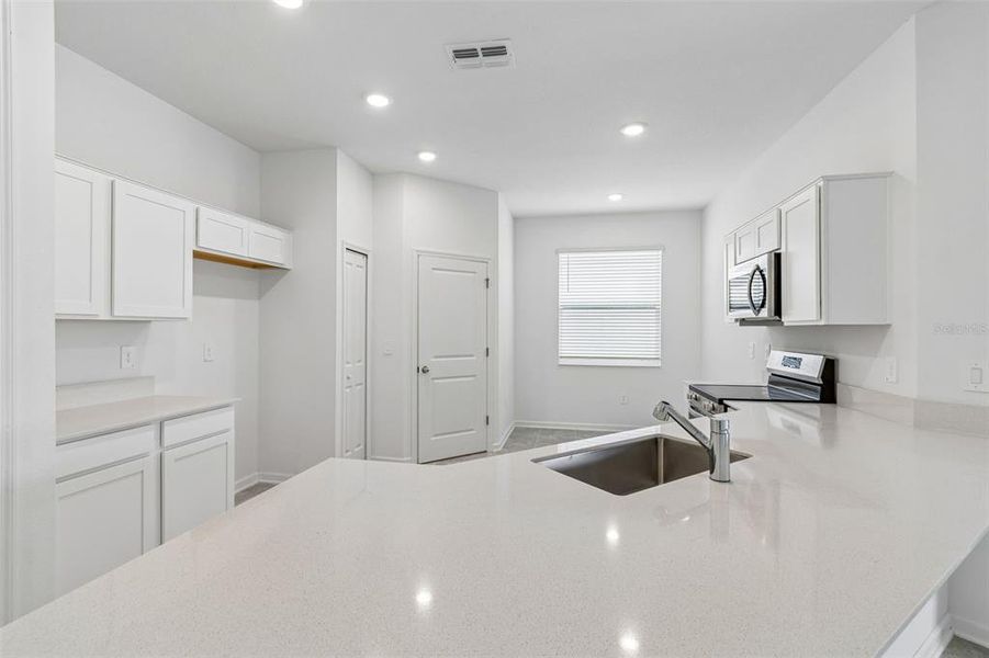 Furnished interior view inside a new home in Peace Creek Reserve, Winter Haven (Image 6).