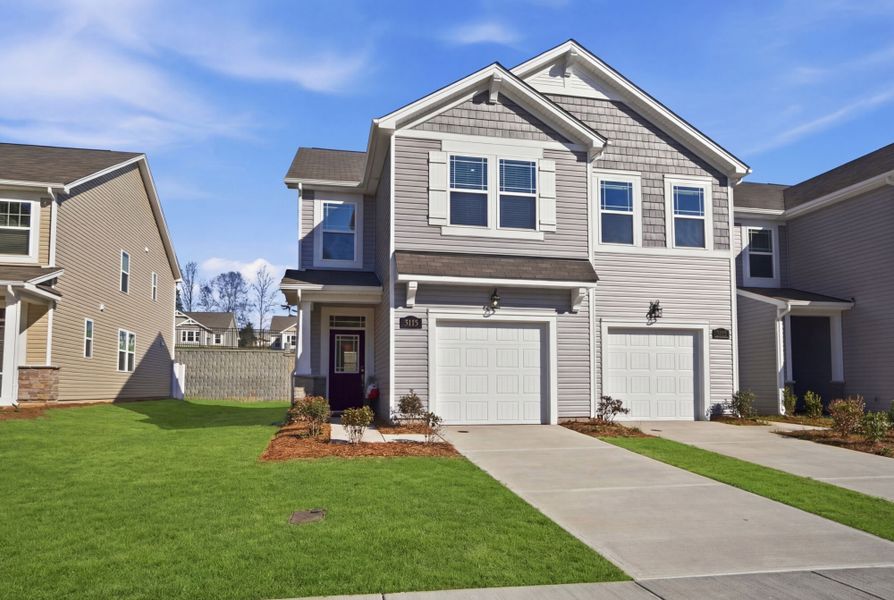 Front exterior of a new home in Hedgecliff Townes, Kannapolis, NC, highlighting curb appeal (Image 1). Front exterior of a new home in Hedgecliff Townes, Kannapolis, NC, highlighting curb appeal (Image 1).