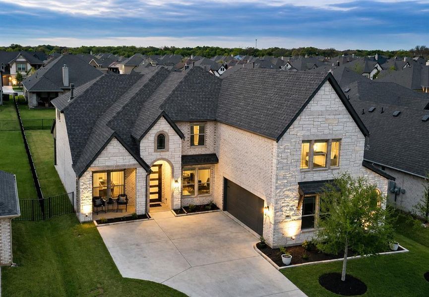 Front exterior of a new home in Abe's Landing, Granbury, TX, highlighting curb appeal (Image 2). Front exterior of a new home in Abe's Landing, Granbury, TX, highlighting curb appeal (Image 2).