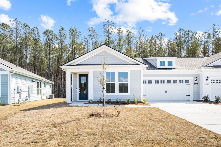Front exterior of a new home in Sun City Hilton Head, Bluffton, SC, highlighting curb appeal (Image 1). Front exterior of a new home in Sun City Hilton Head, Bluffton, SC, highlighting curb appeal (Image 1).