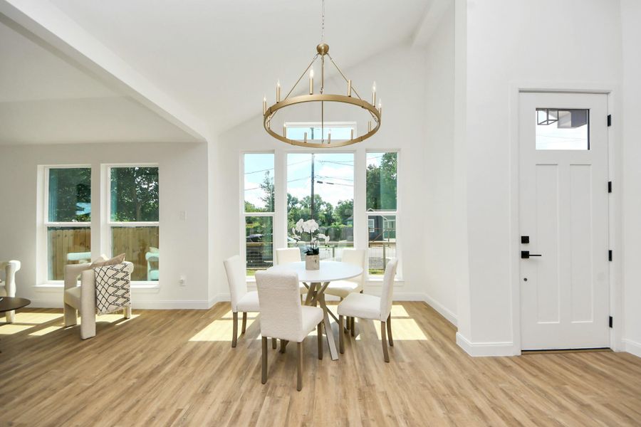 A sleek modern chandelier sets the tone for both casual dinners and special celebrations. Gather around the table as golden sunlight pours in through expansive window. The open layout flows effortlessly into a cozy sitting area—ideal for lingering conversations, entertaining guests, or enjoying quiet moments with family. A sleek modern chandelier sets the tone for both casual dinners and special celebrations. Gather around the table as golden sunlight pours in through expansive window. The open layout flows effortlessly into a cozy sitting area—ideal for lingering conversations, entertaining guests, or enjoying quiet moments with family.