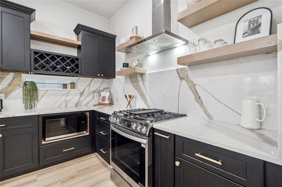 With stainless-steel appliances, ample counter space, and a stunning backsplash, this kitchen is both functional and aesthetically appealing