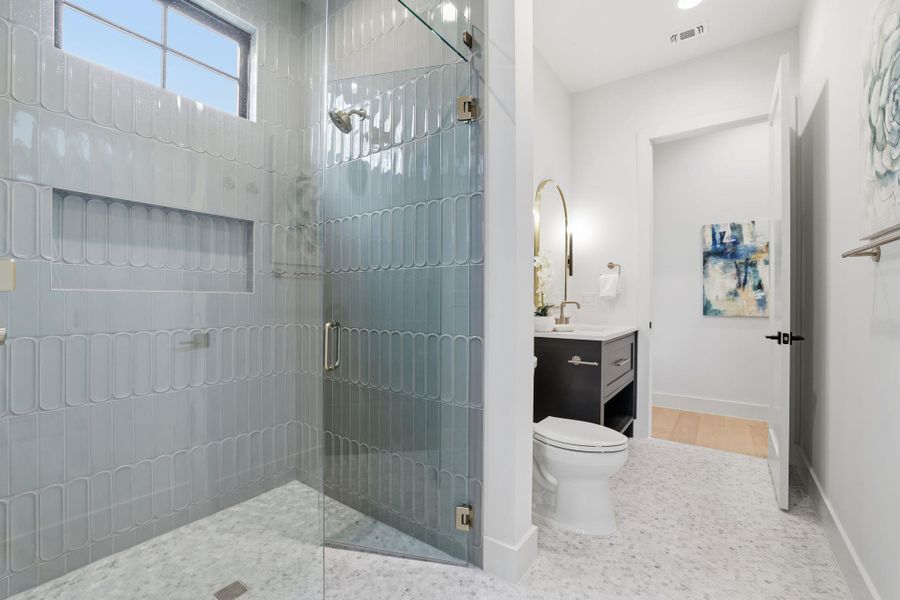 Full bath with vanity and a shower stall