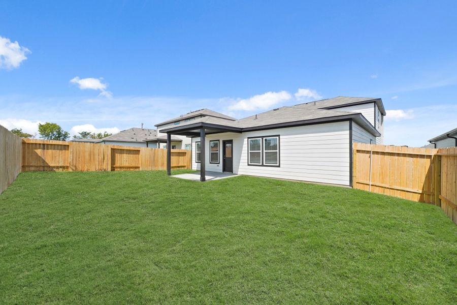 A house with a fence around it.