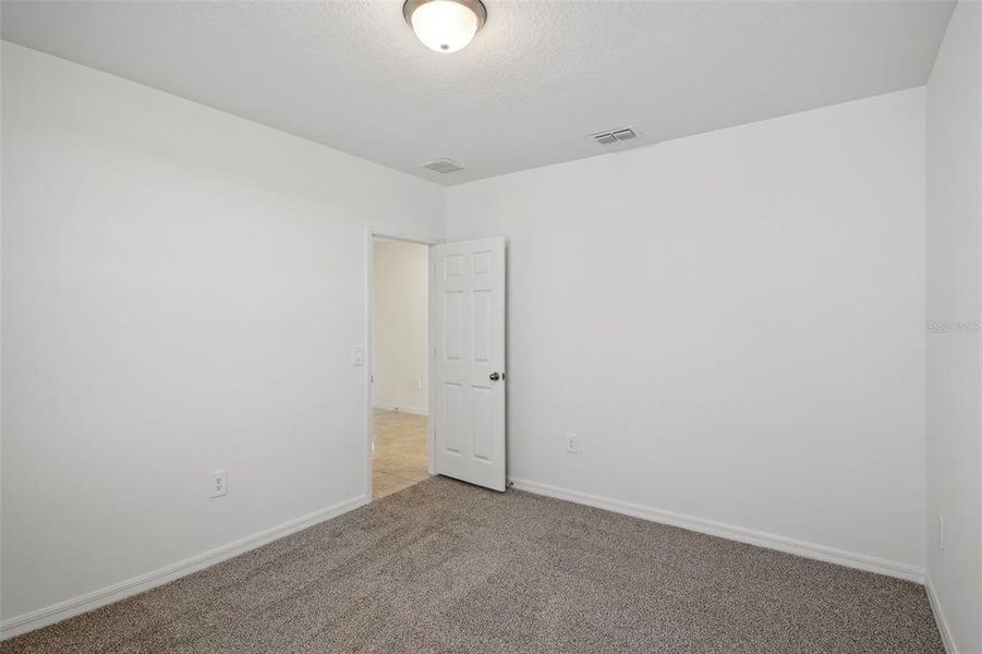 Spacious, unfurnished interior of a new home in Lake Deer Estates - Signature Series, Poinciana (Image 31). Spacious, unfurnished interior of a new home in Lake Deer Estates - Signature Series, Poinciana (Image 31).