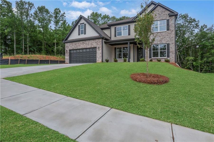 Front exterior of a new home in Arbor West, Dawsonville, GA, highlighting curb appeal (Image 31).