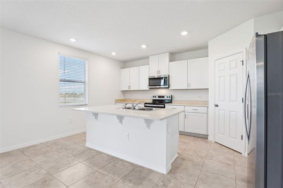 Furnished interior view inside a new home in Lake Deer Estates - Signature Series, Poinciana (Image 16). Furnished interior view inside a new home in Lake Deer Estates - Signature Series, Poinciana (Image 16).
