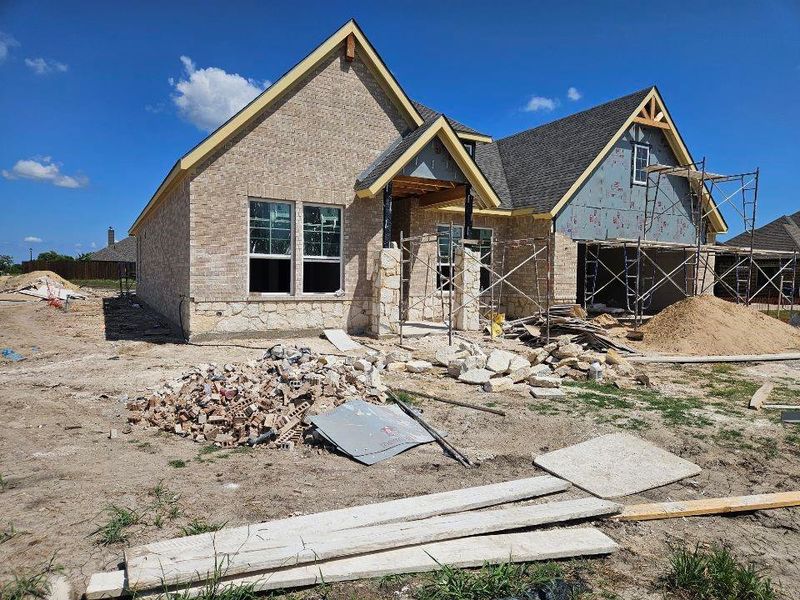 Front exterior of a new home in Aero Vista, Caddo Mills, TX, highlighting curb appeal (Image 10).