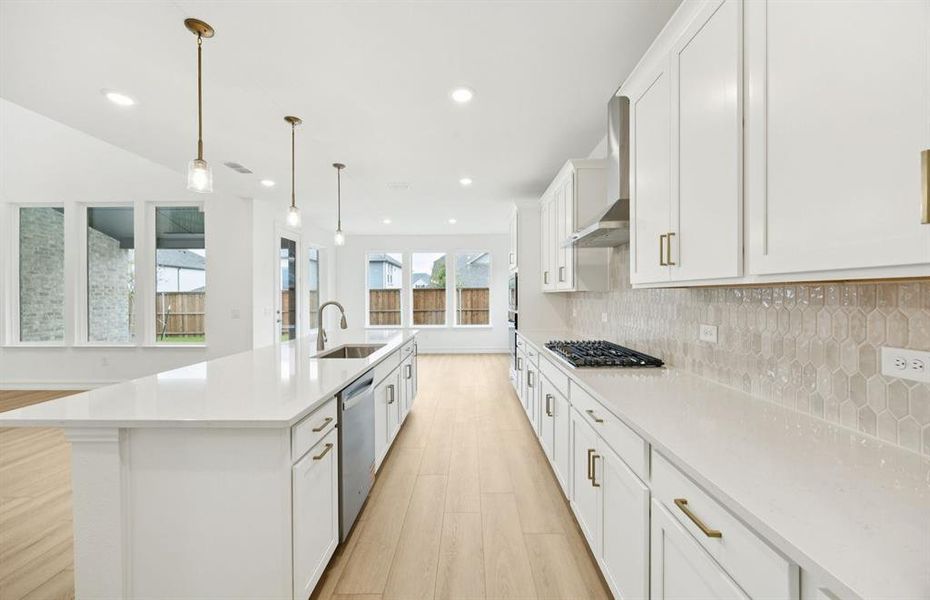 Spacious kitchen with eat-in bartop island  *Model Representation*