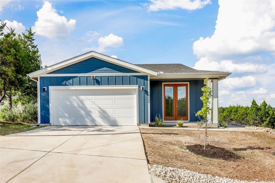 Front exterior of a new home in , Lago Vista, TX, highlighting curb appeal (Image 23).