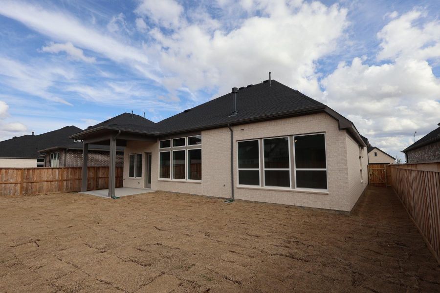 Exterior details and patio area of a home in Dunham Pointe, Cypress (Image 24). Exterior details and patio area of a home in Dunham Pointe, Cypress (Image 24).