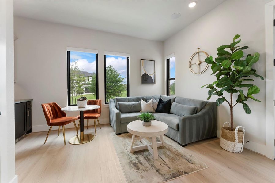 Guest quarter living area with lake views provides a separate place to relax, work, or watch TV away from the main living areas. It creates privacy while still keeping guests connected to the home.