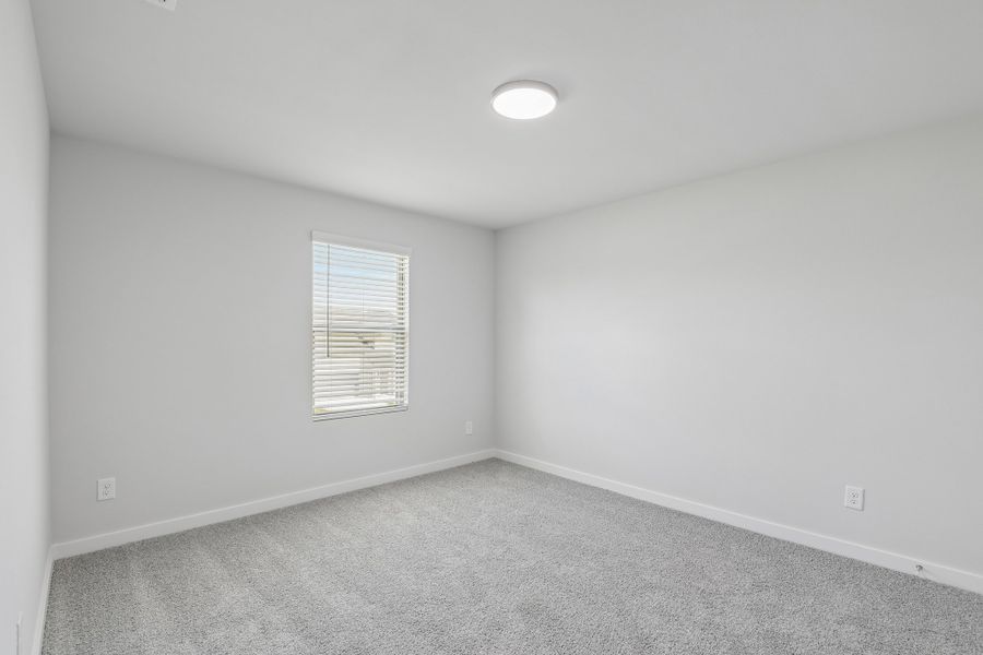Bedroom in the Holden home plan by Trophy Signature Homes