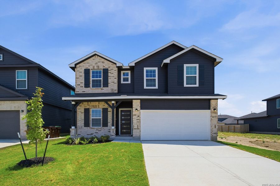 Front exterior of a new home in Red Hawk Landing, San Antonio, TX, highlighting curb appeal (Image 2).