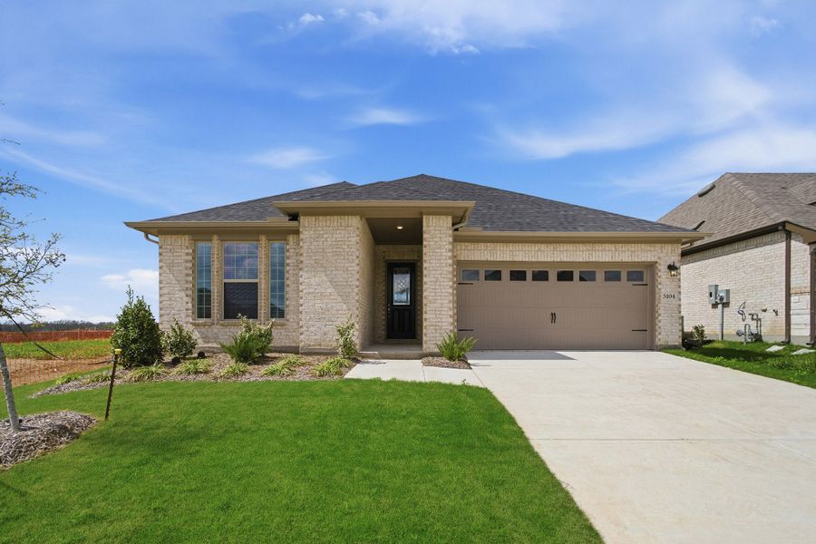 Front exterior of a new home in Westridge, McKinney, TX, highlighting curb appeal (Image 1). Front exterior of a new home in Westridge, McKinney, TX, highlighting curb appeal (Image 1).