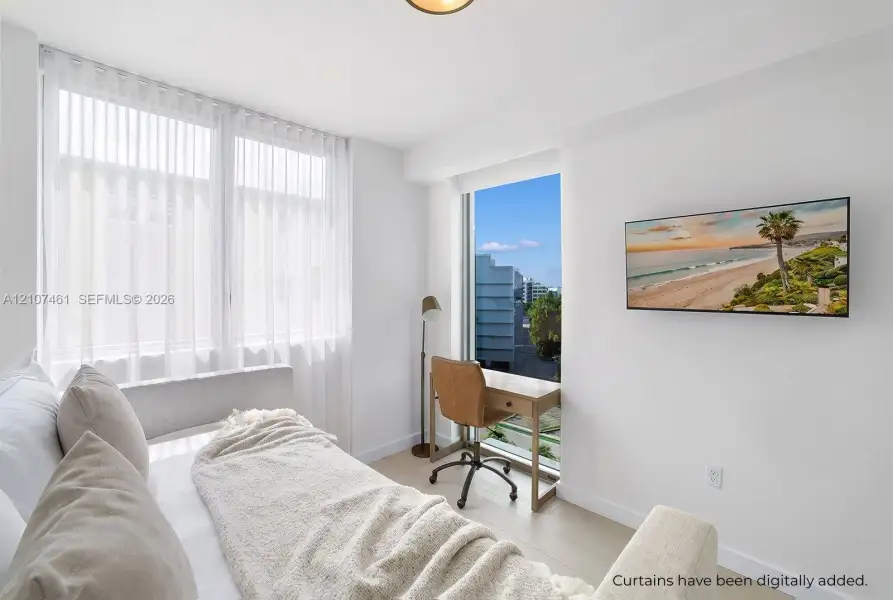 Bright interior featuring large floor-to-ceiling windows, light-toned wood-finish flooring, and crisp white walls Bright interior featuring large floor-to-ceiling windows, light-toned wood-finish flooring, and crisp white walls