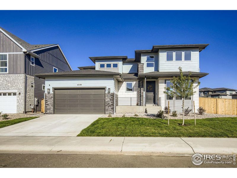 Front exterior of a new home in , Timnath, CO, highlighting curb appeal (Image 20).
