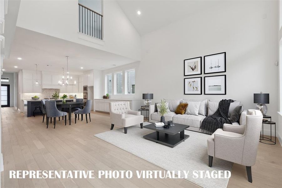 With a spacious family room open to the dining room and kitchen, our Justin plan was designed for entertaining!  REPRESENTATIVE PHOTO VIRTUALLY STAGED