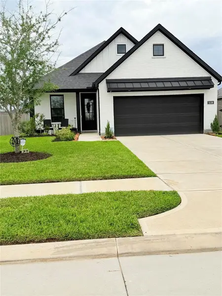 Front exterior of a new home in , Richmond, TX, highlighting curb appeal (Image 22).