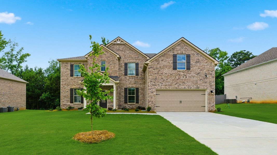 Representative exterior photo of a completed home built from the Meridian II by DRB Homes in Cambria at Traditions, Hampton, GA (Image 22). Representative exterior photo of a completed home built from the Meridian II by DRB Homes in Cambria at Traditions, Hampton, GA (Image 22).