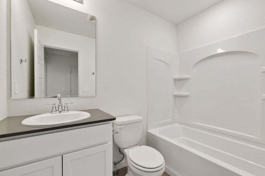 Representative furnished interior of a home built from the Pinecliffe by Baessler Homes in Liberty Draw, Evans (Image 13).