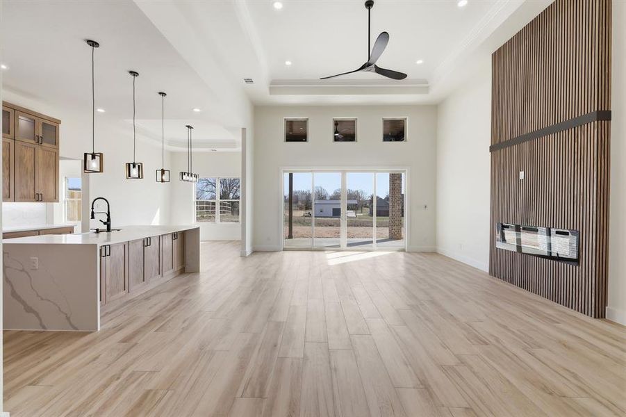 Living room with 13' tiered ceilings accented with LED lighting. Living room with 13' tiered ceilings accented with LED lighting.