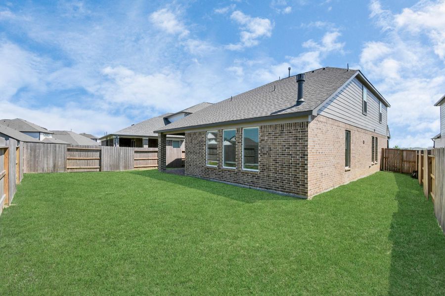 Discover the charm of this spacious backyard featuring a delightful covered patio. With ample room for both play and relaxation, it's the perfect outdoor haven. Tailor this space to your liking with patio furniture, a BBQ pit, and more. The potential for creating your dream outdoor living area is limitless! Discover the charm of this spacious backyard featuring a delightful covered patio. With ample room for both play and relaxation, it's the perfect outdoor haven. Tailor this space to your liking with patio furniture, a BBQ pit, and more. The potential for creating your dream outdoor living area is limitless!