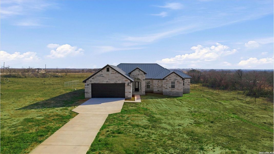 Front exterior of a new home in , St. Hedwig, TX, highlighting curb appeal (Image 30). Front exterior of a new home in , St. Hedwig, TX, highlighting curb appeal (Image 30).