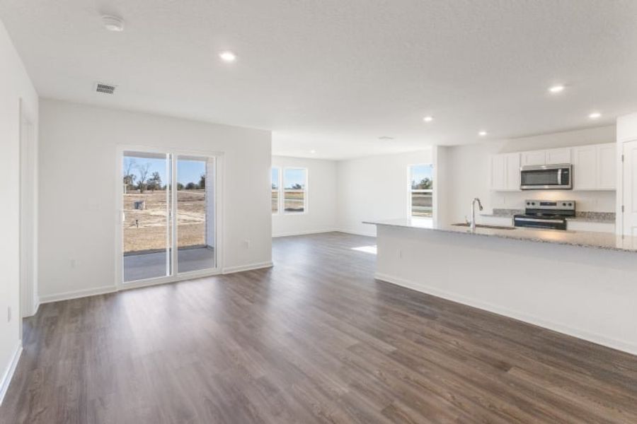 A large kitchen with white cabinets.