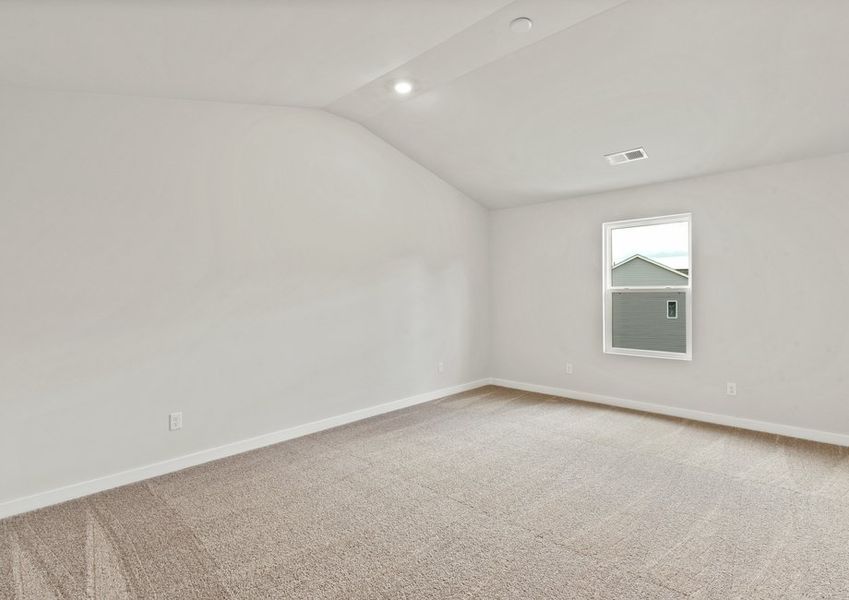 The master bedroom has lots of windows to let in natural light