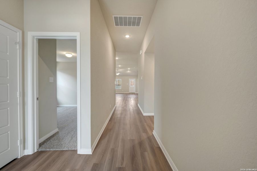 Spacious, unfurnished interior of a new home in Hunters Ranch, San Antonio (Image 40).