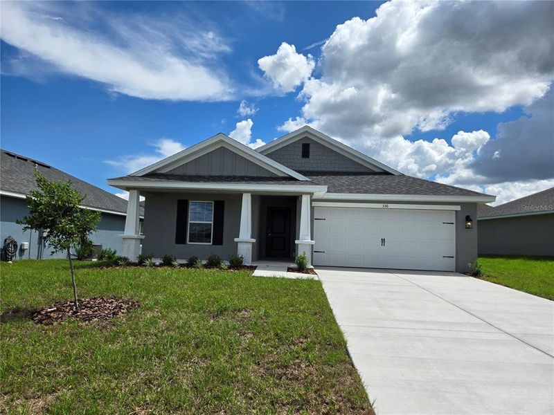 Front exterior of a new home in Twisted Oaks, Beverly Hills, FL, highlighting curb appeal (Image 1). Front exterior of a new home in Twisted Oaks, Beverly Hills, FL, highlighting curb appeal (Image 1).