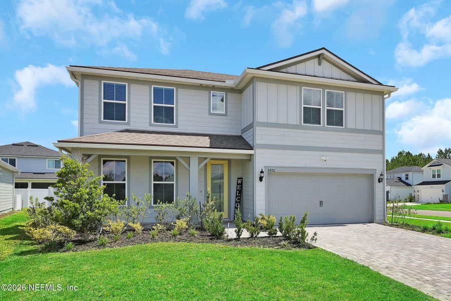 Front exterior of a new home in Double Branch, Middleburg, FL, highlighting curb appeal (Image 1). Front exterior of a new home in Double Branch, Middleburg, FL, highlighting curb appeal (Image 1).